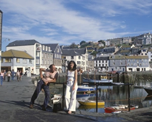Leaning Gallery: People by the harbour, Mevagissey, Cornwall