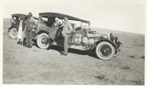Suitcases Prints: Four people with two loaded cars, Middle East