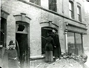 Bullet Prints: People looking at bullet holes after Sidney Street Siege