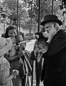 People and parrot at London Zoo