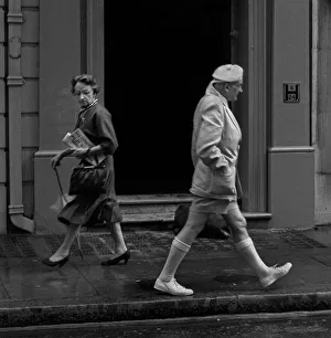 Tammy Gallery: Two people pass each other in a London street