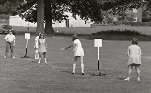 Bats Prints: Five people playing a ball game in a field