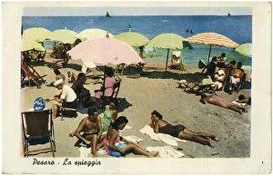 People relaxing on the beach, Pesaro, Italy