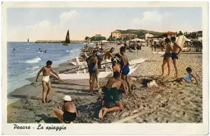 People relaxing on the beach, Pesaro, Italy
