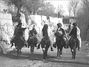 Five people riding donkeys, Kashgar