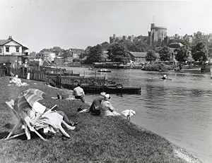 Deckchair Prints: People on the riverbank near Windsor Castle, Berkshire Date: circa 1960s