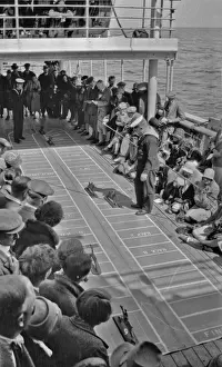 Racecourse Prints: People on ships deck playing a game