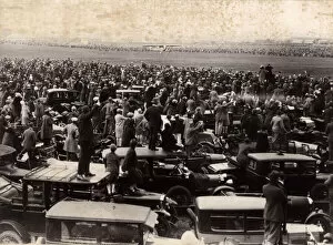 Roofs Collection: People standing on car roofs to see a plane landing