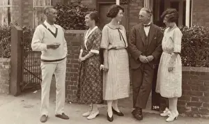 Shoe Prints: Five people standing outside a house