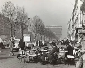 People at tables in the Champs Elysees, Paris