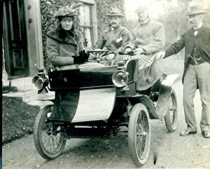 Antique Collection: Four people with a veteran antique car