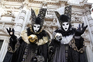 People wearing Venice Carnival Costumes