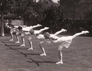 Balances Prints: Six perform balances in garden