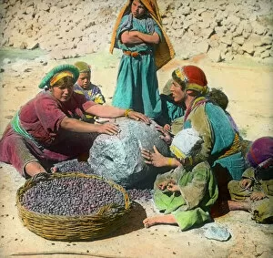 Images Dated 30th April 2021: Persian women using a large grindstone, Iran