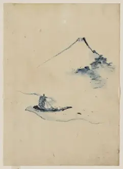 A person in a small boat on a river with Mount Fuji in the b