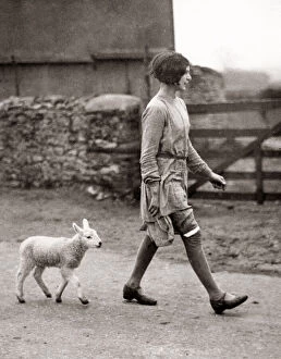 Lamb Collection: Pet lamb and girl on a farm in Oxfordhsire, 1930 s
