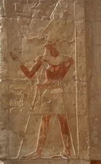 Pharaoh with the false beard and Atef crown. Deir el-Bahari
