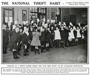 Thrift Prints: Photograph of children in a North London school holding up their National war-savings certificates