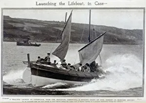 Photograph of a practice launch of the Lifeboat, Coversack, Cornwall. Outdoor seascape action shot. Captioned, Launching the Lifeboat, in case