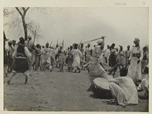 Photograph of Sudanese preparing for battle