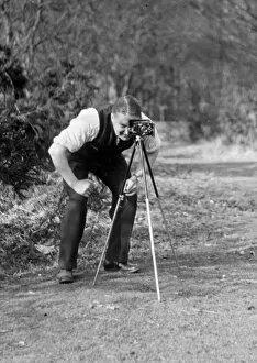 Photographer with camera and tripod