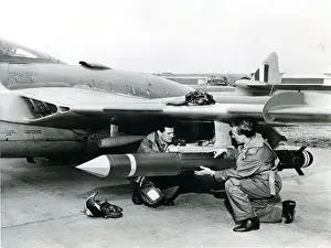 Navigator Prints: The pilot and navigator carry out final checks of a de ?