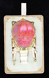 Images Dated 15th May 2018: Pink and gold balloon on a movable greetings card