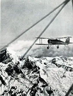 Approaching Prints: Plane flying at 32, 000 feet approaching Mount Everest