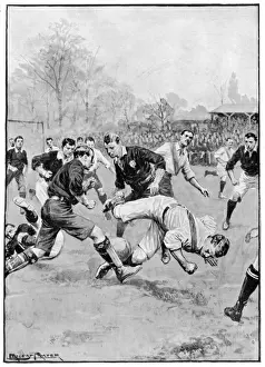 A player falls during a football match