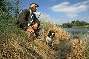 Shotgun Gallery: Poacher with gun and dog, Cambridgeshire fens