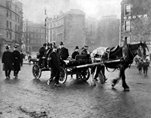 Images Dated 2nd February 2012: Police escorting a cart during Dundee riots, Scotland