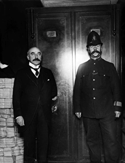 Images Dated 2nd February 2012: Police guard MP at 5, 000 slate club share out