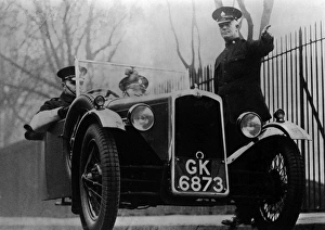 Images Dated 22nd February 2011: Police officer giving directions