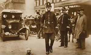 Images Dated 18th December 2007: Police Officer & Stray