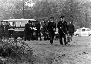 Searching Gallery: Police officers with dogs, conducting a search, London