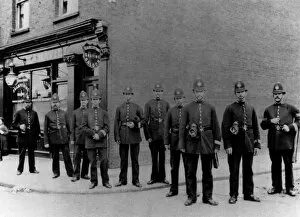 Images Dated 22nd February 2011: Police officers outside a barbers shop