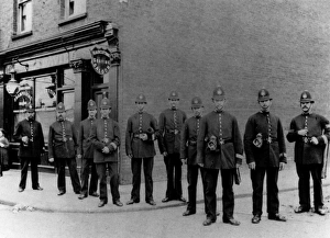 Images Dated 22nd February 2011: Police officers outside a barbers shop