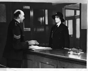 Armbands Gallery: Two police officers in a police station, London