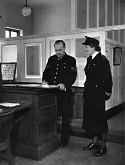 Armbands Gallery: Two police officers working in a station, London