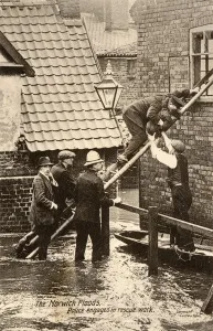 Floods Prints: Police rescue a small boy during the Floods in Norwich