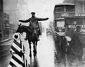 Directs Prints: POLICE / TRAFFIC DUTY / RAIN