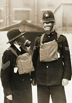 Demonstrating Gallery: Policeman and policewoman with gas masks