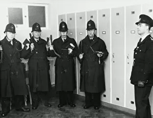 Uniforms Collection: Policemen in station parade room, London