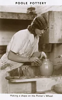Industry Gallery: Poole Pottery - Shaping a pot on the potters wheel