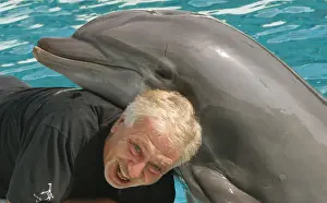 Dolphins Prints: Portait of photographer Leandro A. Stanzani with Dolphin