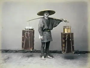 Porter with shoulder pole, full-length studio portrait, stan
