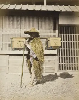 Porter wearing protective outer garments made of straw