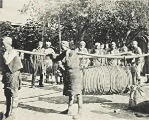 Fascination Prints: Porters carrying a large barrel on two long yolks
