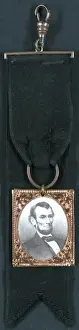 Portrait of Abraham Lincoln attached to black ribbon