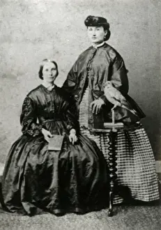 Dove Prints: Portrait group of two ladies and bird